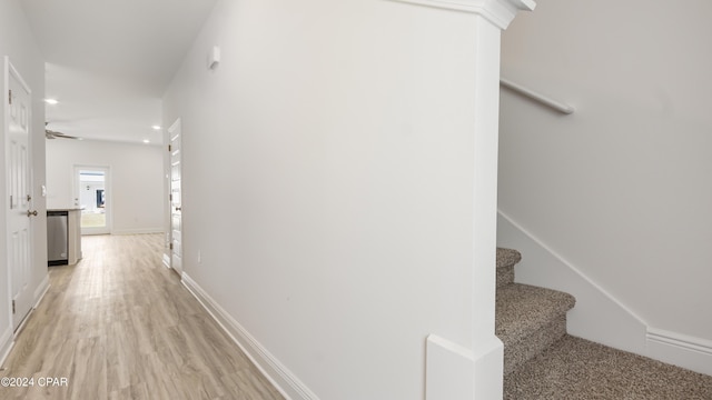 hall with light hardwood / wood-style floors