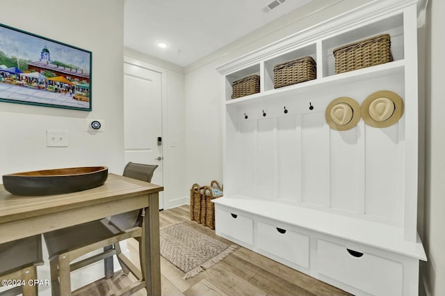 mudroom with hardwood / wood-style floors