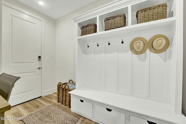 mudroom with light hardwood / wood-style flooring