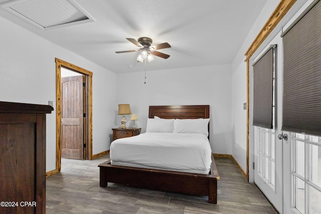 bedroom with ceiling fan and dark wood-type flooring