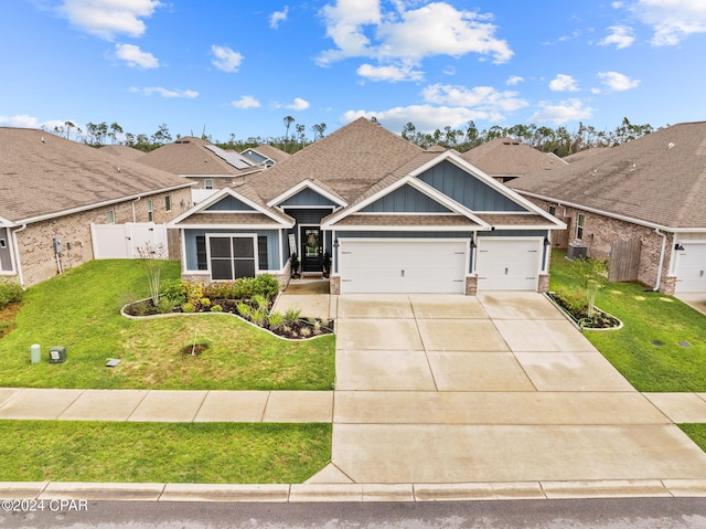 view of front of home featuring a garage and a front lawn