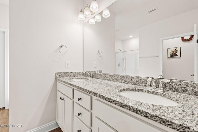 bathroom with vanity and an enclosed shower