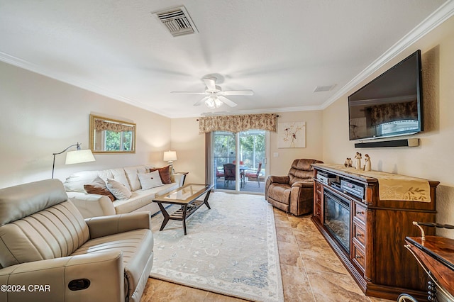 living room featuring ceiling fan and ornamental molding