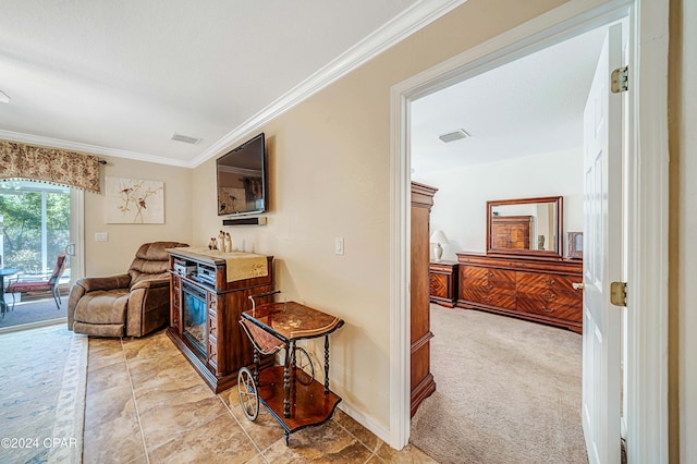 corridor with light colored carpet and crown molding