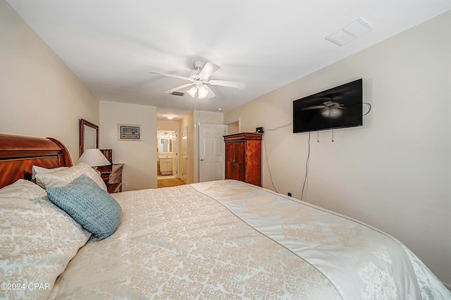 bedroom featuring ceiling fan and ensuite bathroom