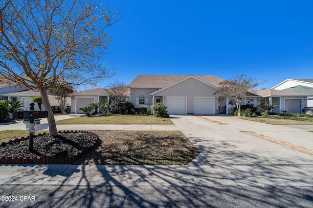 ranch-style house featuring a garage