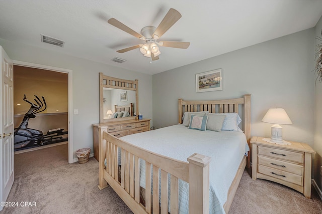 bedroom featuring light carpet and ceiling fan