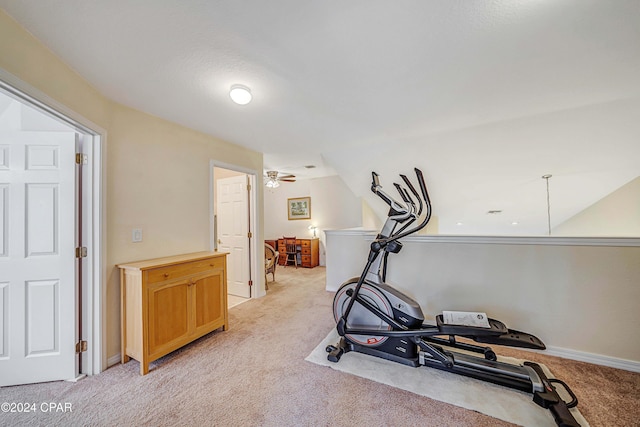 workout area with light colored carpet and ceiling fan