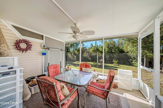 sunroom with plenty of natural light and ceiling fan