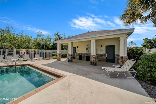 view of swimming pool with a patio area