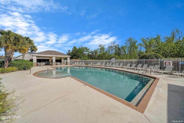 view of pool featuring a gazebo and a patio