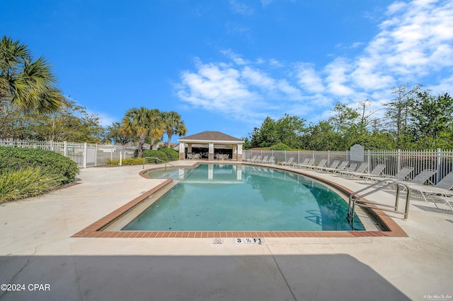 view of swimming pool featuring a patio area