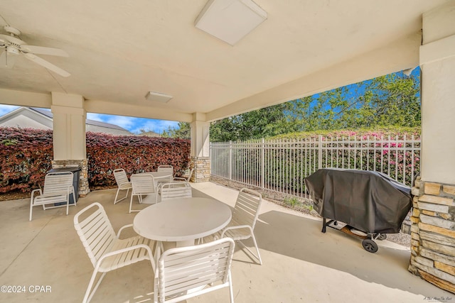 view of patio with area for grilling and ceiling fan