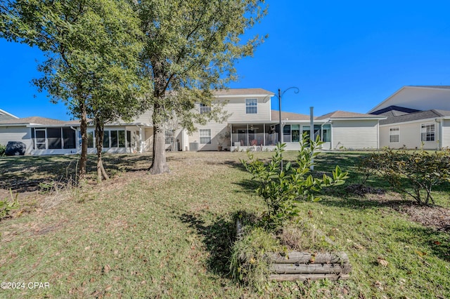 view of yard featuring a sunroom