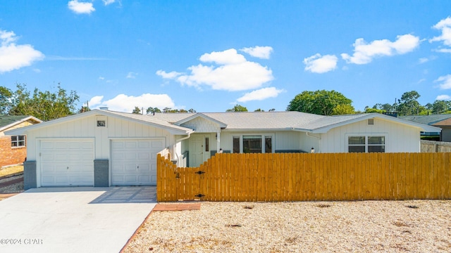 ranch-style home featuring a garage