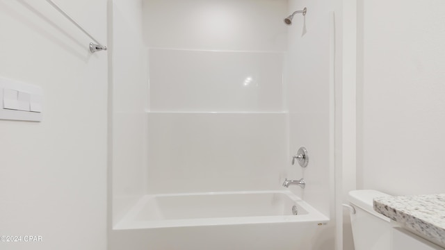 full bathroom with shower / tub combination, vanity, and toilet