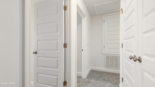 hallway with light colored carpet