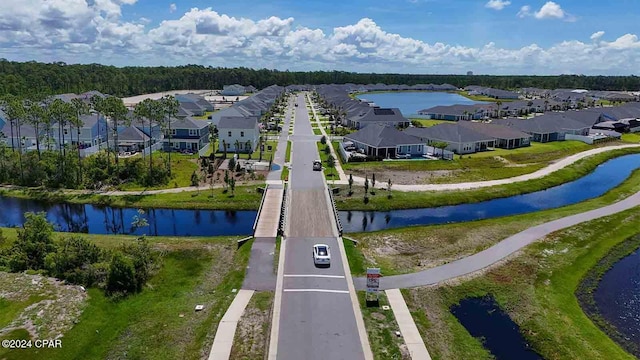 birds eye view of property featuring a water view