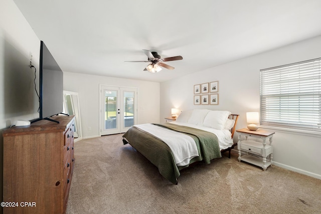 carpeted bedroom featuring ceiling fan, access to exterior, and french doors