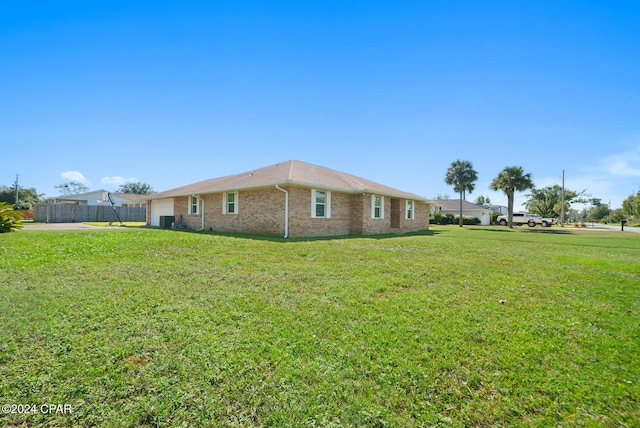 view of property exterior featuring a lawn