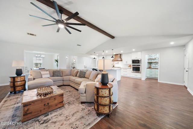 living room featuring ceiling fan with notable chandelier, lofted ceiling with beams, and dark hardwood / wood-style floors