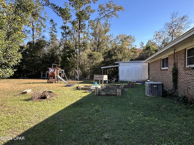 view of yard with a playground and cooling unit