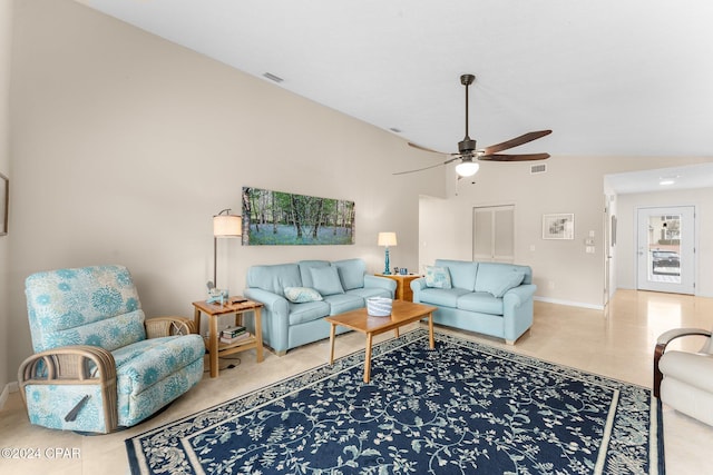 living room with ceiling fan and high vaulted ceiling