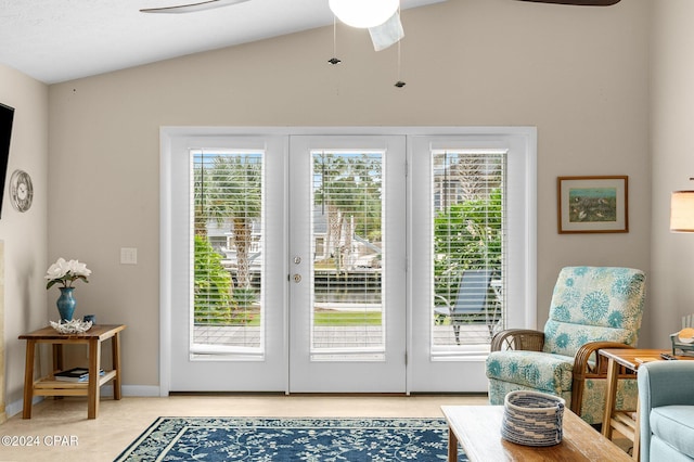 doorway with a healthy amount of sunlight, vaulted ceiling, and french doors