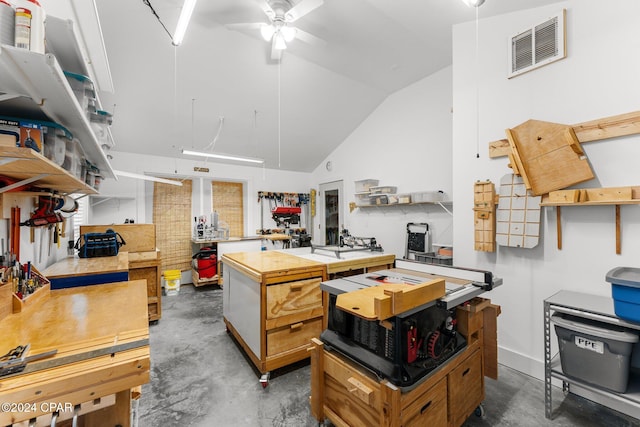 kitchen featuring ceiling fan and vaulted ceiling