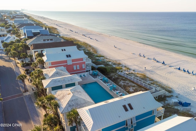 aerial view with a water view and a view of the beach