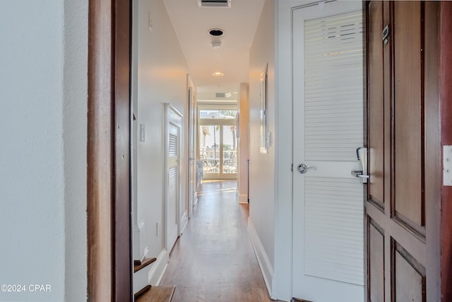 hallway with light wood-type flooring