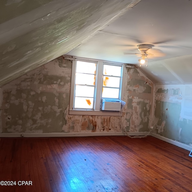 bonus room featuring wood-type flooring, cooling unit, ceiling fan, and lofted ceiling