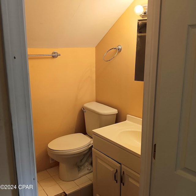 bathroom featuring tile patterned flooring, vanity, and toilet