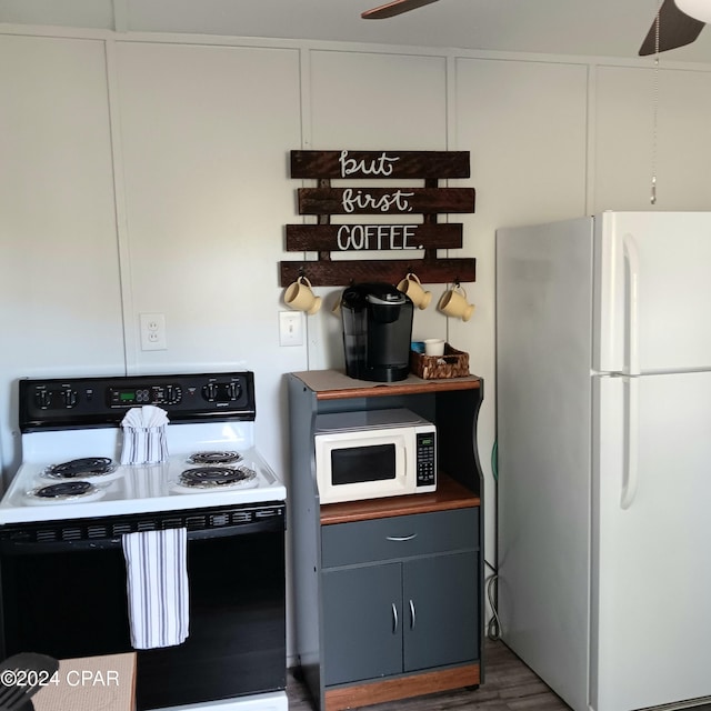 kitchen featuring blue cabinetry, white appliances, ceiling fan, and dark wood-type flooring