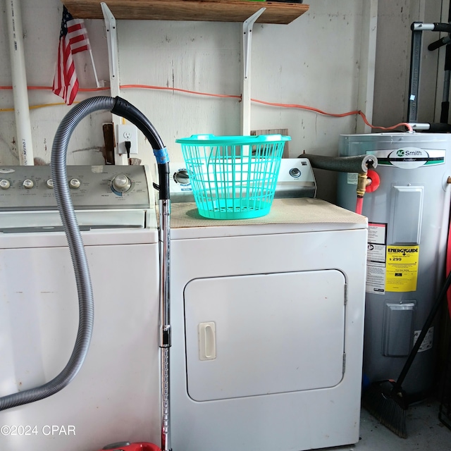 washroom featuring washer and clothes dryer and water heater