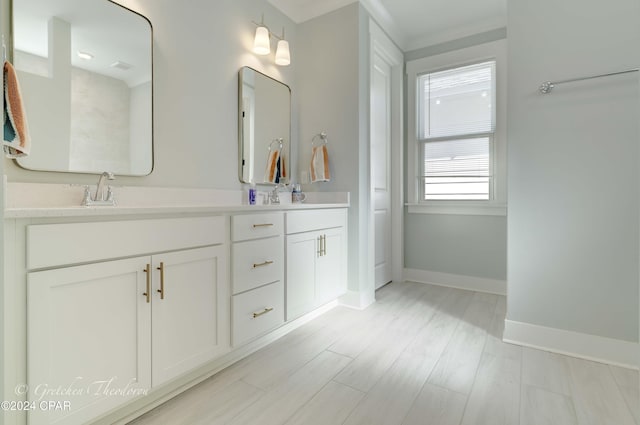 bathroom featuring hardwood / wood-style floors and vanity