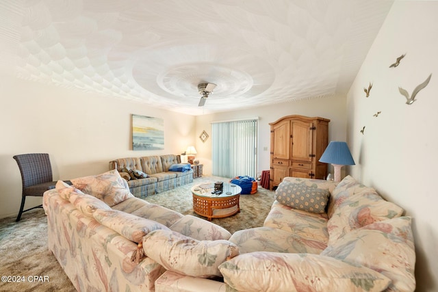 carpeted living room featuring ceiling fan