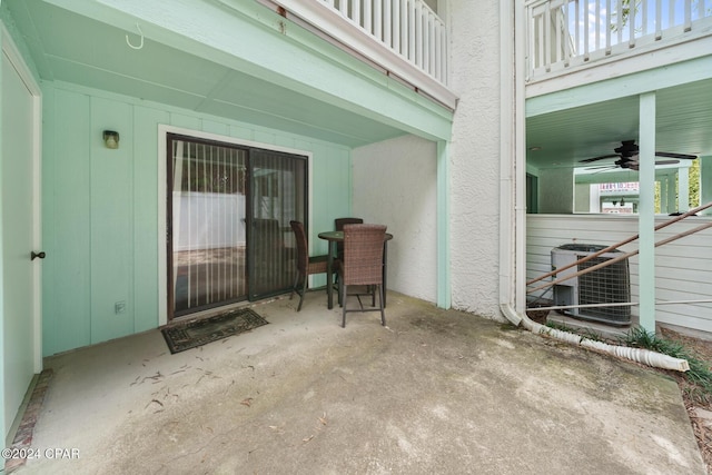 view of patio featuring ceiling fan, a balcony, and cooling unit