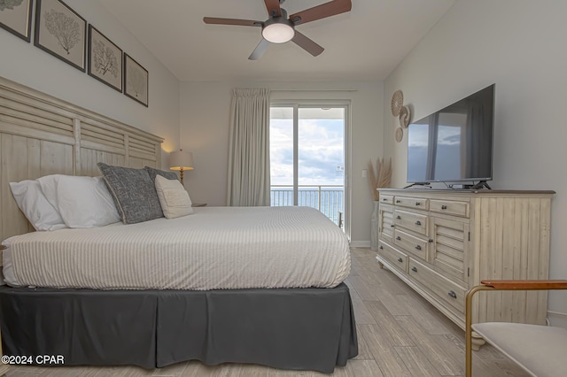 bedroom featuring ceiling fan, light wood-type flooring, and access to outside