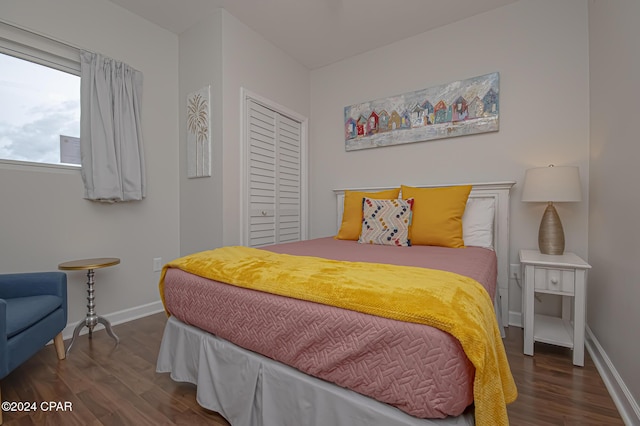 bedroom with dark wood-type flooring