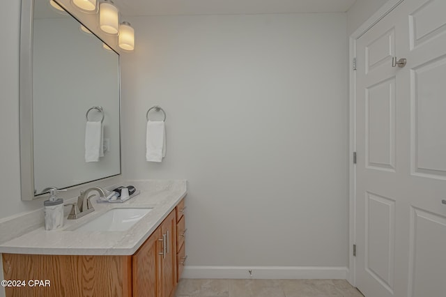 bathroom with tile patterned flooring and vanity