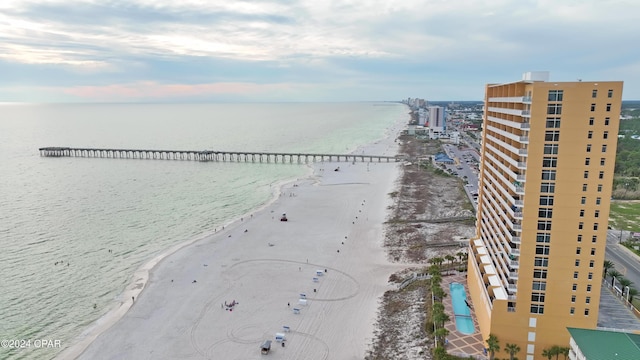 birds eye view of property featuring a water view and a view of the beach