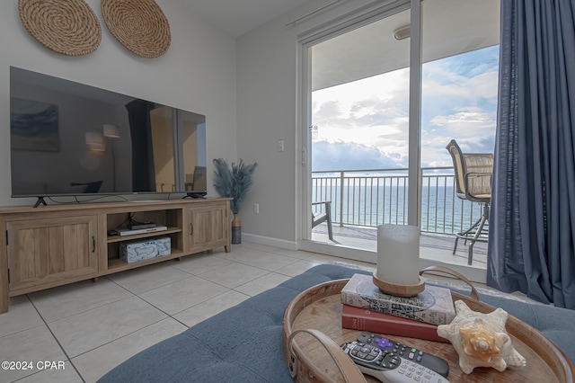 tiled living room with a water view