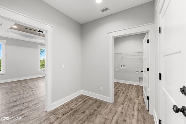 laundry area with ceiling fan, hookup for a washing machine, and light wood-type flooring