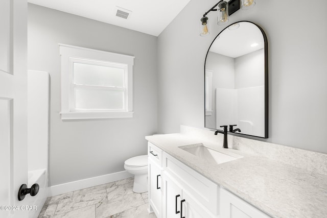 full bathroom with shower / tub combination, vanity, and toilet