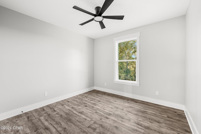 spare room with wood-type flooring and ceiling fan