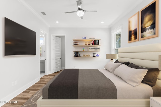 bedroom featuring hardwood / wood-style flooring, ornamental molding, connected bathroom, and ceiling fan