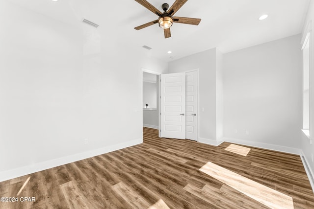 unfurnished bedroom featuring hardwood / wood-style flooring and ceiling fan