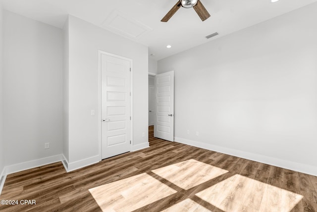 unfurnished bedroom with dark wood-type flooring and ceiling fan