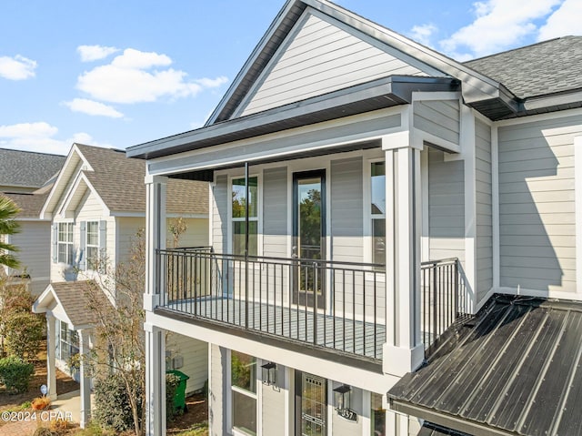 view of side of property featuring a balcony